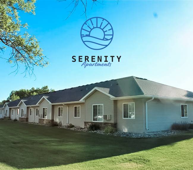 Serenity Apartments exterior with logo